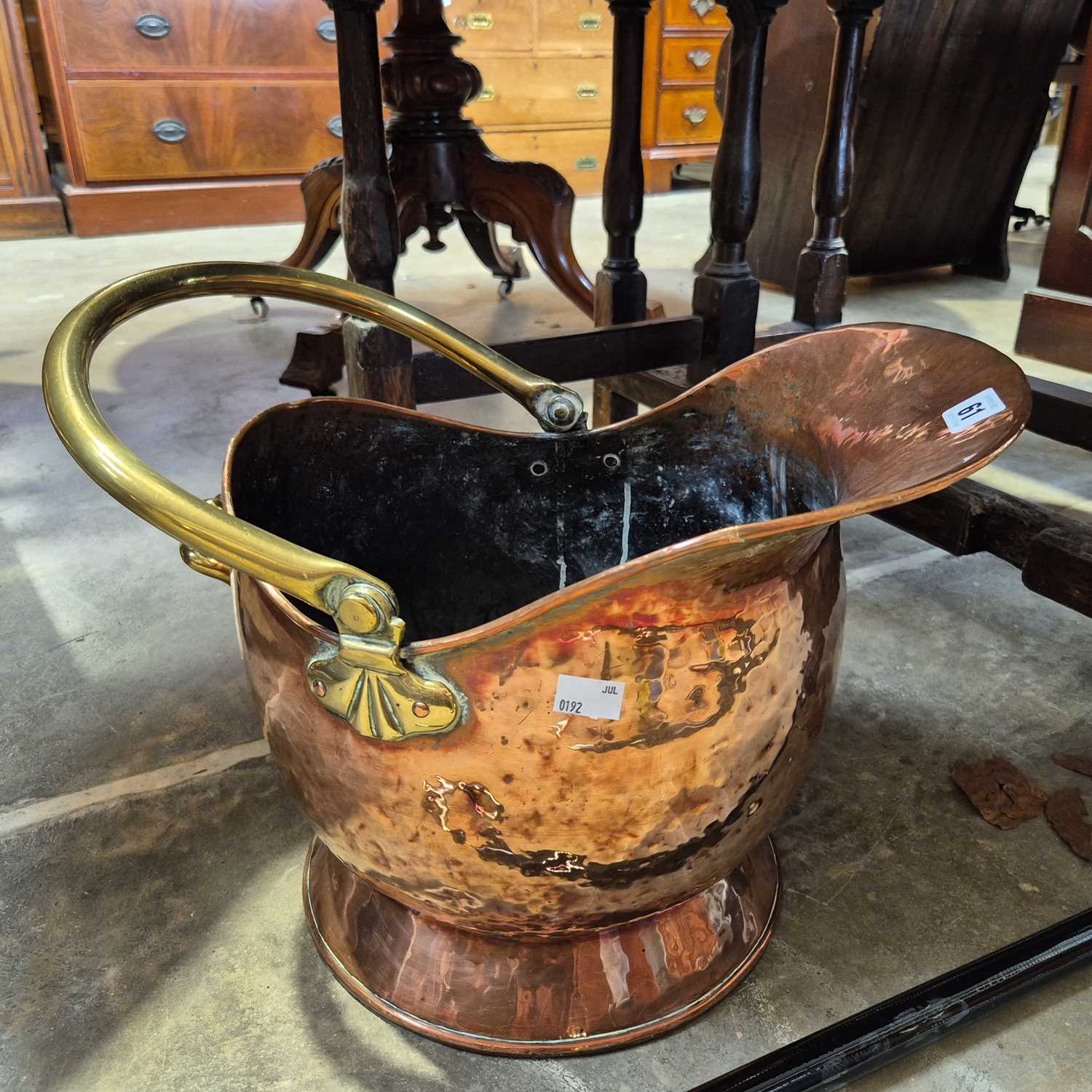 Lot 61 - A 19th-century copper and brass coal scuttle.