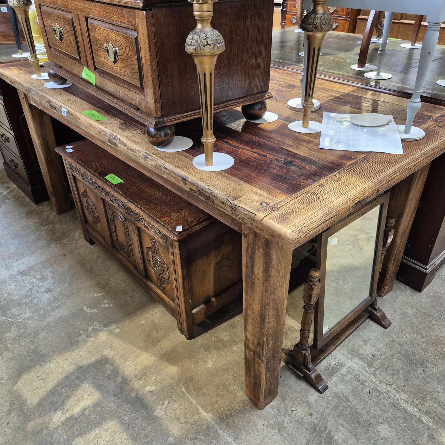 Lot 70 - A rustic large scullery table on square taper...