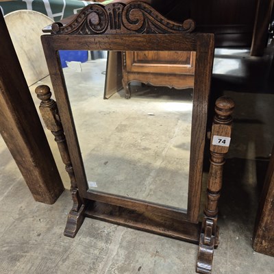 Lot 74 - An oak swing mirror.