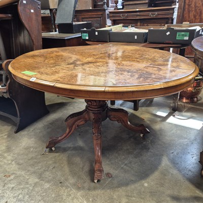 Lot 87 - A Victorian walnut breakfast table on carved...