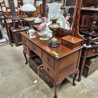 Lot 98 - A mahogany dressing table on cabriole legs....