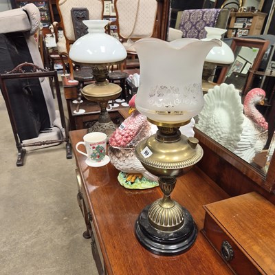 Lot 99 - Two brass oil lamps.