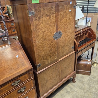 Lot 121 - A walnut veneered drinks cabinet. 77 x 38 x...