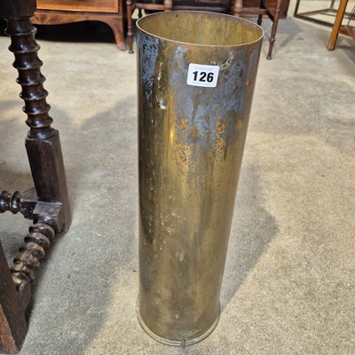Lot 126 - A large brass shell case stick stand.