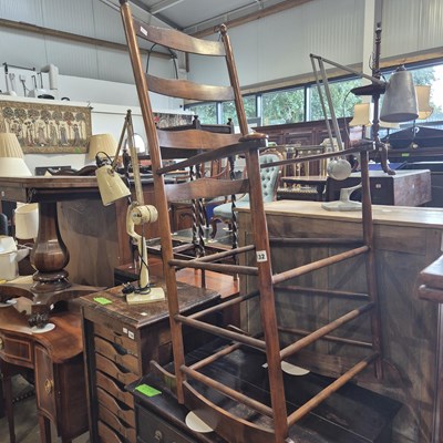Lot 132 - An Arts & Crafts-style rocking chair.