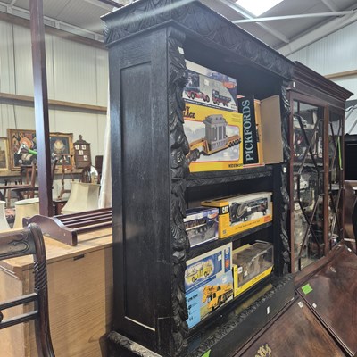 Lot 139 - A Victorian carved oak open front bookcase. 92...