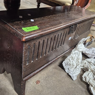Lot 150 - An oak plank coffer with stop fluted carved...