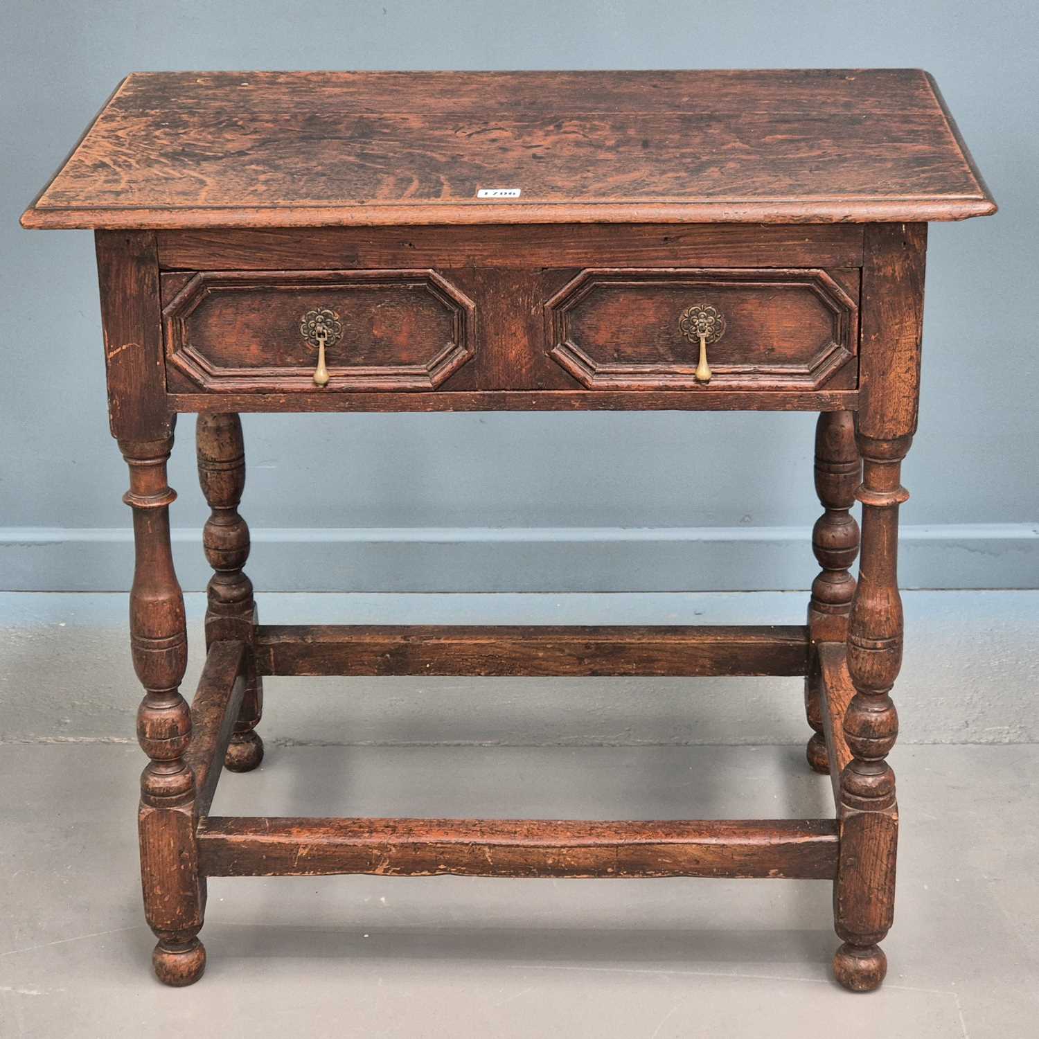 Lot 1706 - A George III oak side table, the drawer