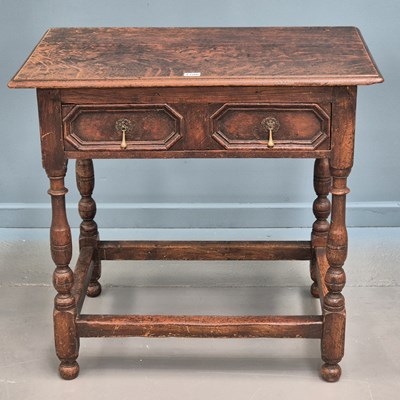 Lot 1706 - A George III oak side table, the drawer with...