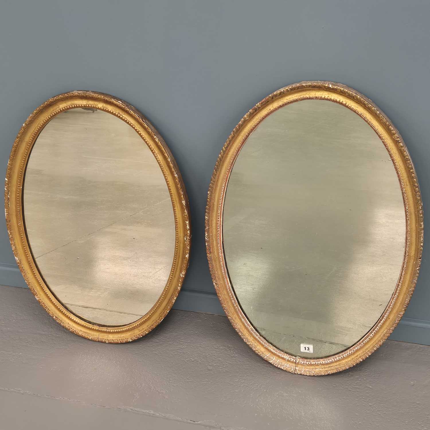 Lot 13 - Two similar Georgian carved giltwood oval...