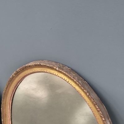 Lot 13 - Two similar Georgian carved giltwood oval...