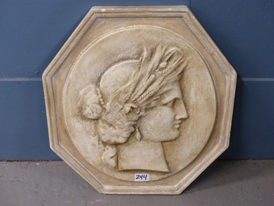 Lot 244 - A decorative plaster octagonal plaque of a...
