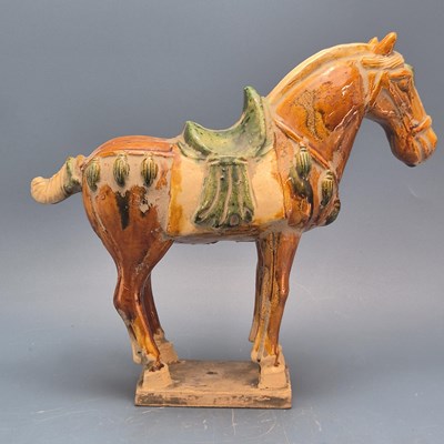 Lot 880 - A leather mountred saddled horse.   H 28cms....