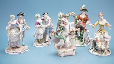 Lot 883 - A Vienna porcelain figure of Cupid holding up...