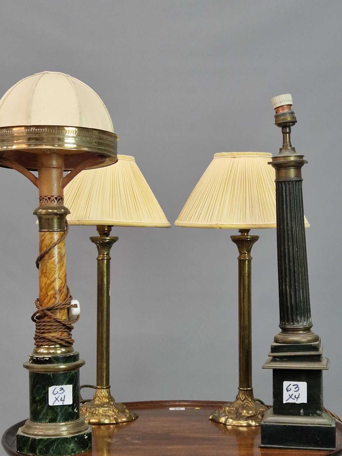 Lot 63 - A small pair of antique brass column lamps,...