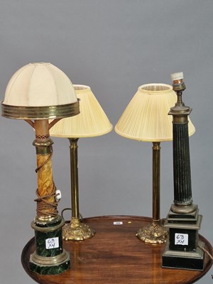 Lot 63 - A small pair of antique brass column lamps,...
