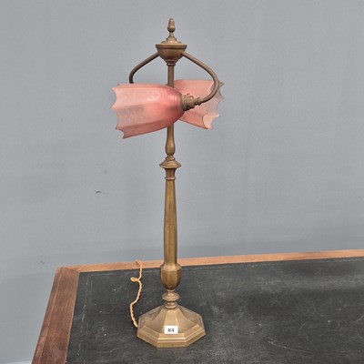 Lot 84 - An early 20th Century brass two light table...