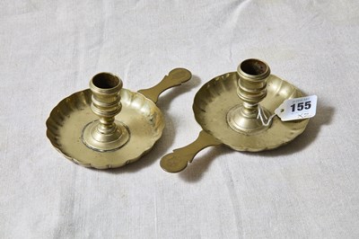 Lot 155 - A pair of early brass chamber candlesticks,...