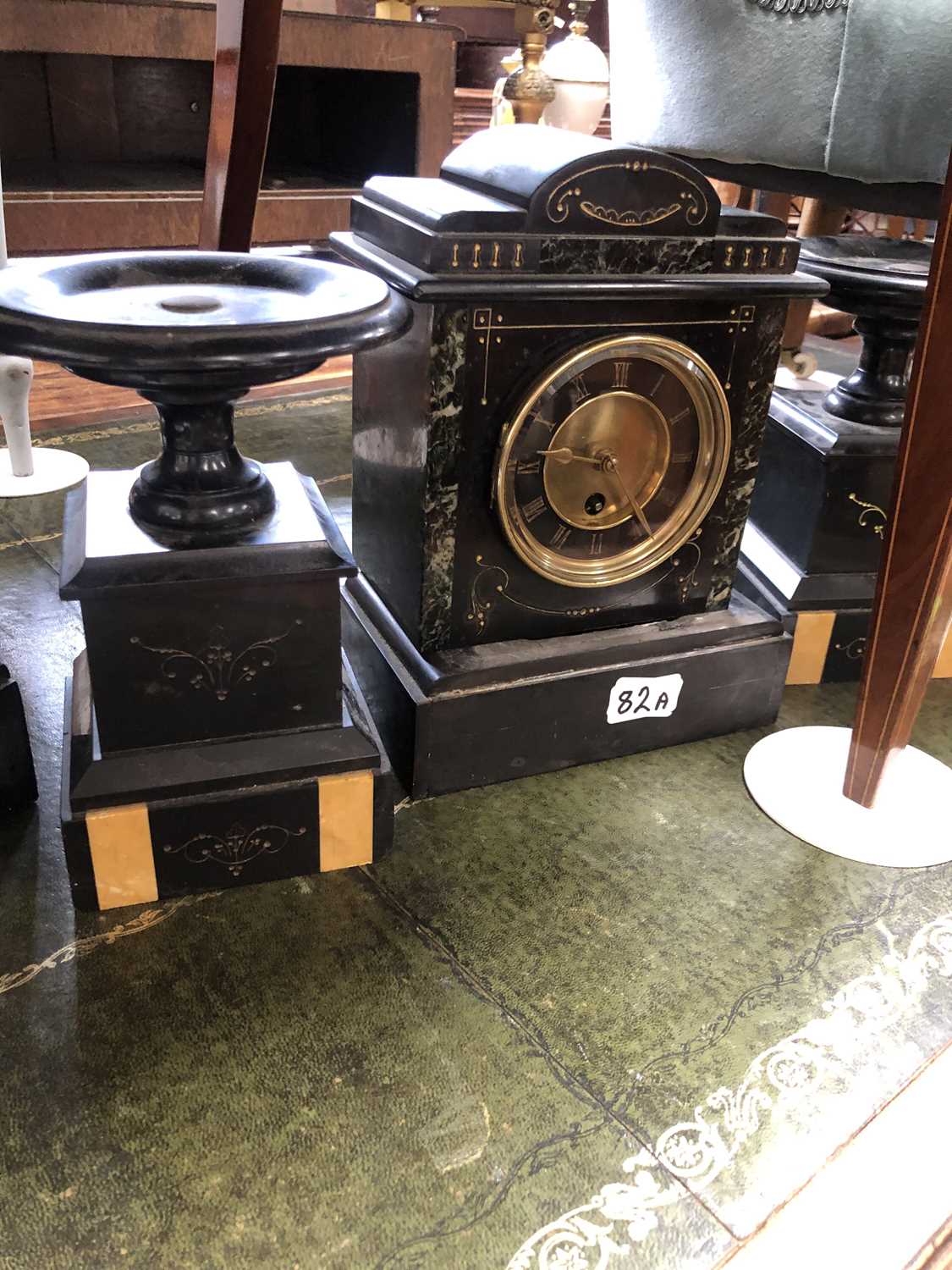Lot 82 - A black slate clock garniture together with a...