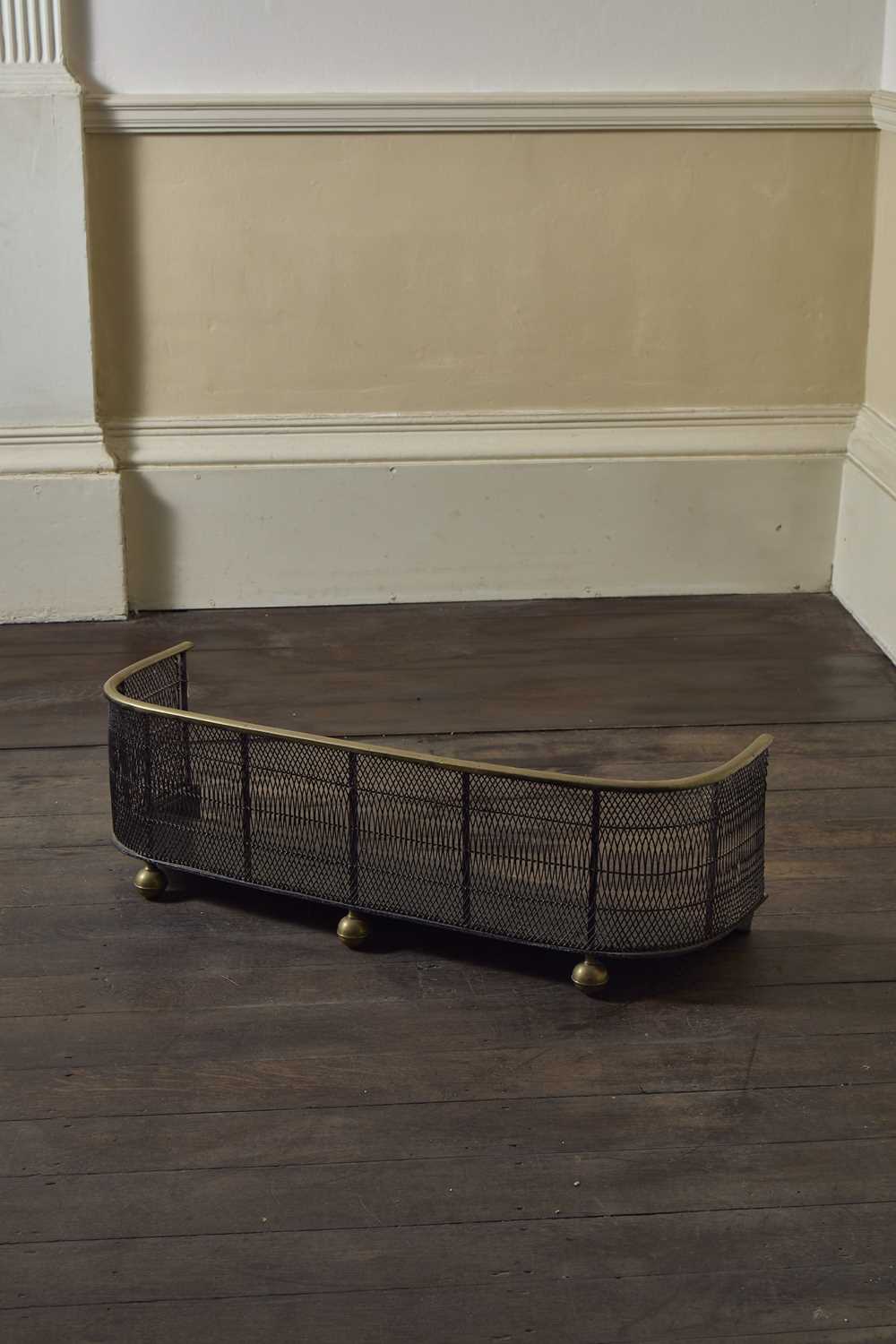 Lot 53 - An early 19th Century wirework and brass fire...