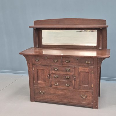 Lot 1735 - A Charles Limbert oak mirror back sideboard,...