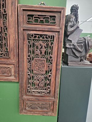 Lot 25 - A pair of carved Oriental panels, together...