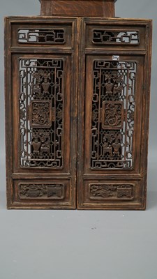 Lot 25 - A pair of carved Oriental panels, together...