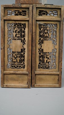 Lot 25 - A pair of carved Oriental panels, together...