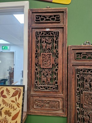 Lot 25 - A pair of carved Oriental panels, together...