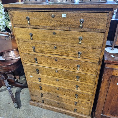 Lot 184 - An unusual oak chest of nine locking drawers...