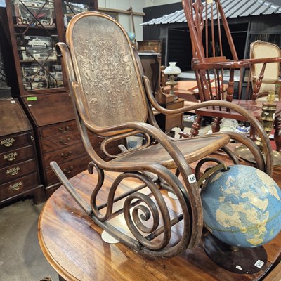 Lot 195 - An antique bentwood rocking chair with an...