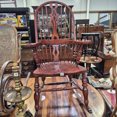 Lot 197 - A rocking chair of Windsor stick back form