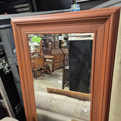 Lot 205 - A modern hard wood framed wall mirror with...