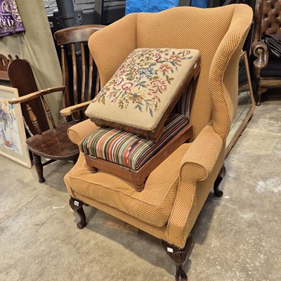 Lot 212 - A Georgian style wingback armchair and two...
