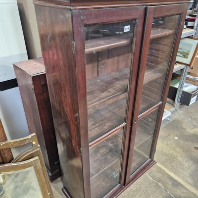 Lot 222 - A Victorian mahogany glazed bookcase standing...