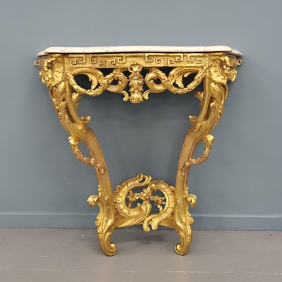 Lot 303 - An antique and later carved giltwood marble...