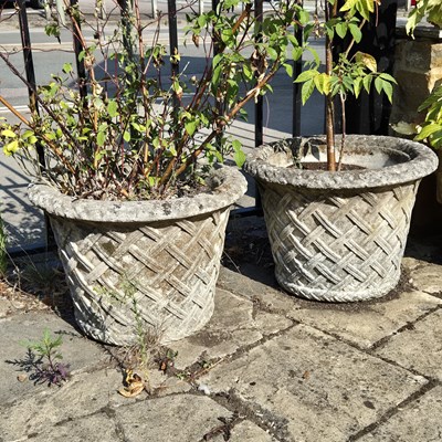 Lot 387 - A large pair of composite stone lattice...
