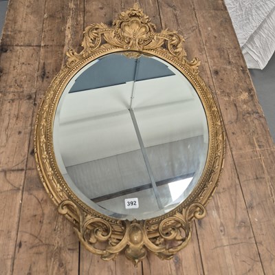 Lot 392 - A pair of Victorian gilt oval mirrors with...