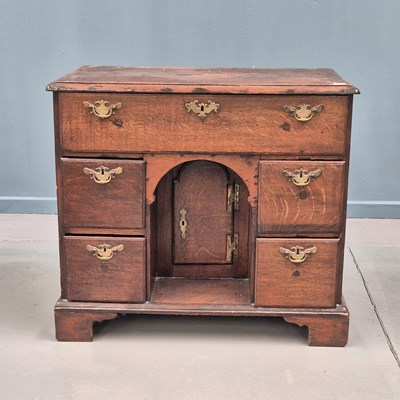 Lot 1325 - An 18th century country oak knee hole desk...