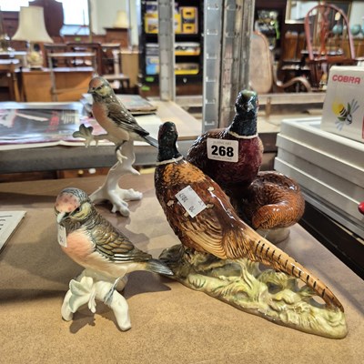 Lot 268 - Four various bird figures, including Besick