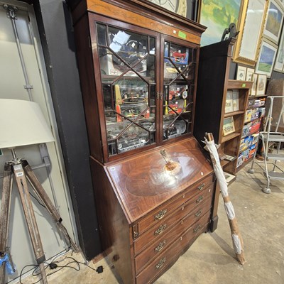 Lot 298 - A Georgian mahogany and inlaid bureau bookcase...