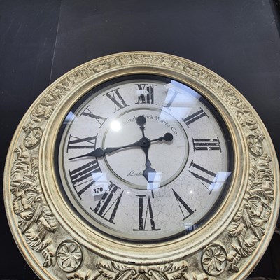 Lot 300 - A large decorotive wall clock