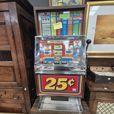 Lot 310 - A vintage one arm bandit gaming machine