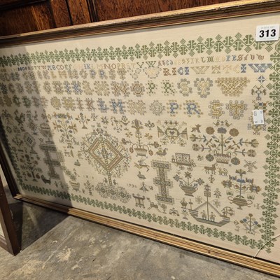 Lot 313 - A large sampler picture
