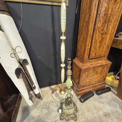 Lot 318 - Two onyx and brass lamps.