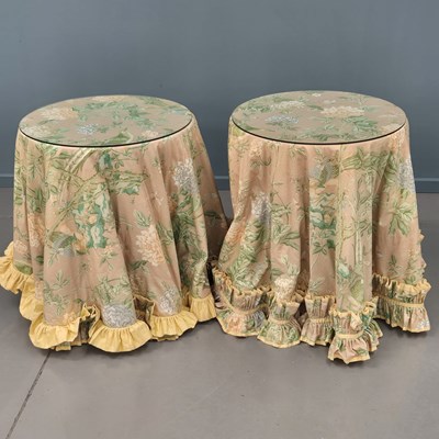 Lot 614 - A pair of bedside tables with draped fabric...