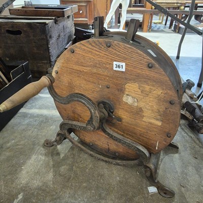 Lot 361 - A vintage cast iron and wood knife polisher