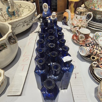 Lot 393 - A quantity of blue glass poison bottles,...