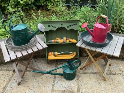 Lot 404 - Two folding teak small garden tables, two...