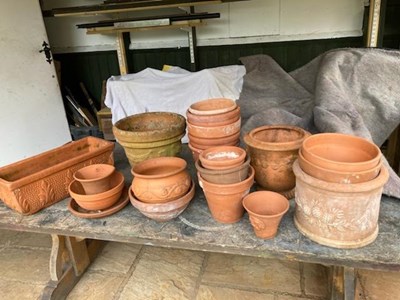 Lot 405 - A large collection of terracotta planters,...